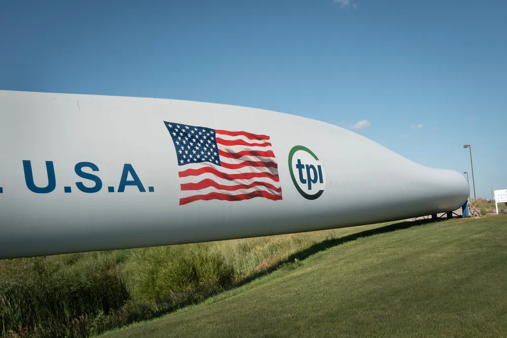 A wind blade is displayed in front of the TPI Composites manufacturing facility in Newton, Iowa.