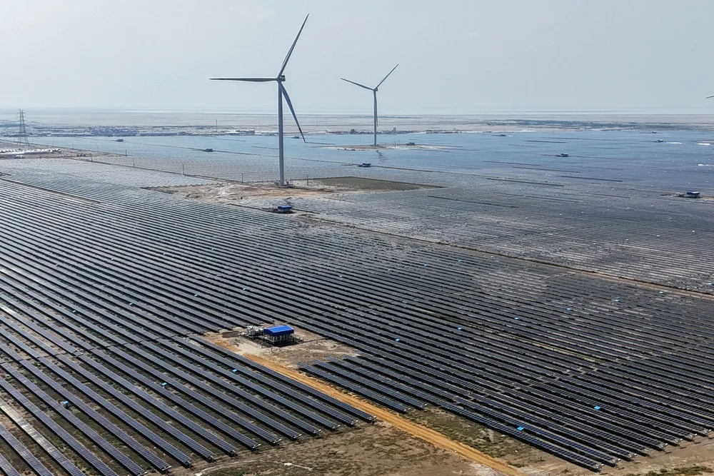 Wind energy and solar panels at the Adani Green Renewable Energy Plant in in India's Gujarat state.
