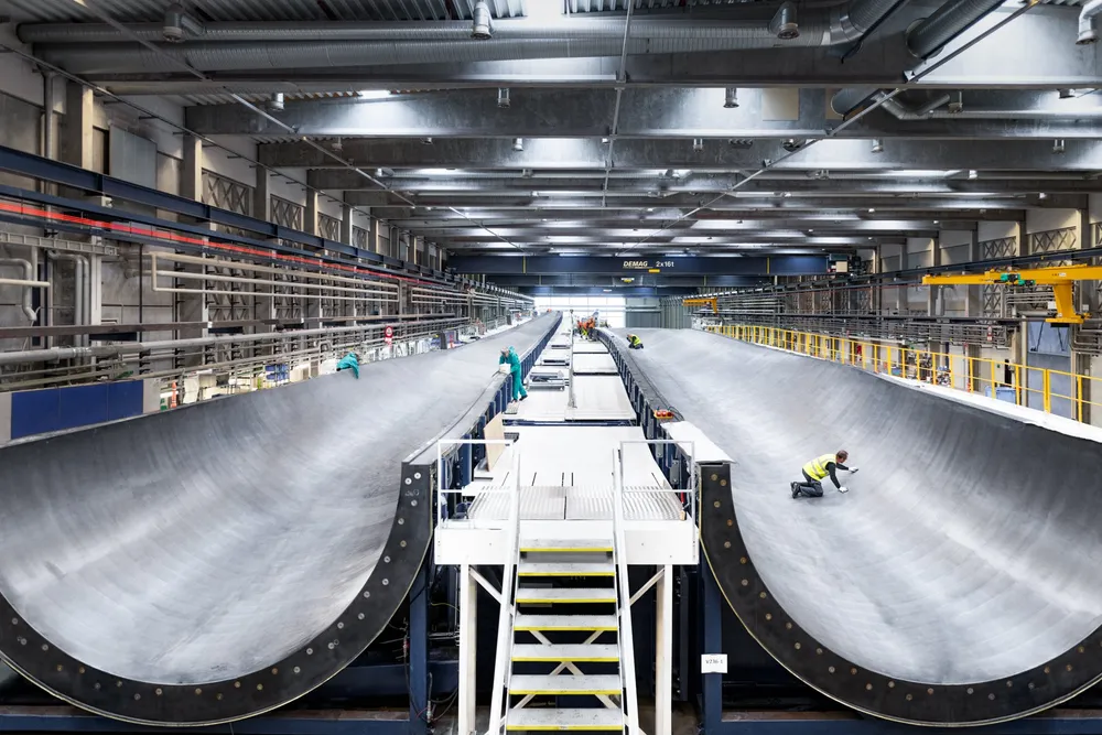 Vestas employees perform final checks on a 15MW-(V236) wind turbine blade mould at an existing factory in Nakskov, Denmark.