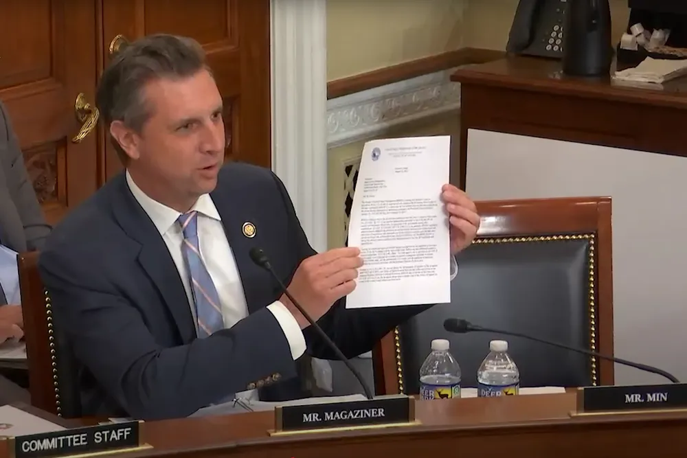 Seth Magaziner, who represents Rhode Island's 2nd Congressional District, brandishes the one page stop work order while questioning the DoI official.